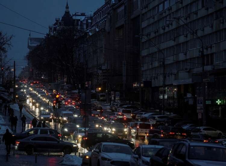 Cars on a street in Kyiv during a power blackout amid Russian missile attacks - Global Banking & Finance Review