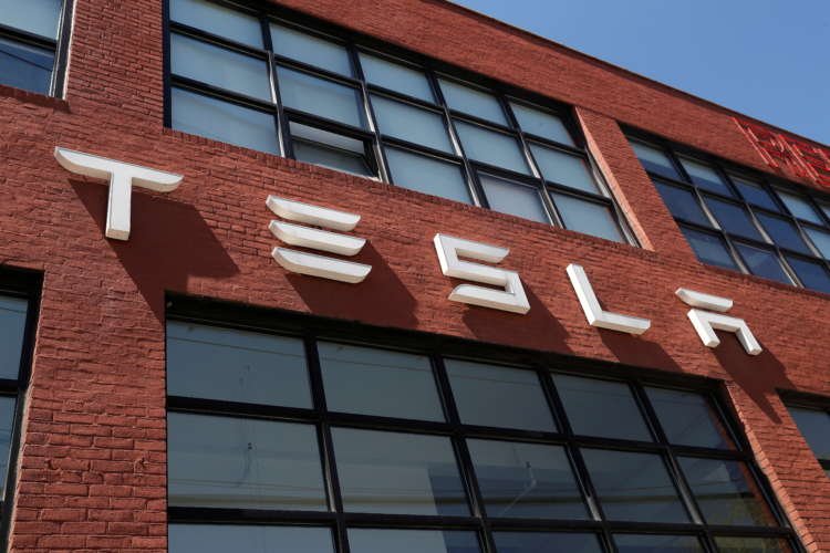 Tesla edges past Wall Street target as bitcoin sales, environmental credits boost revenue