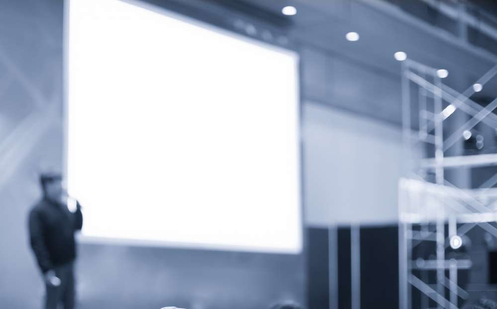 Person confidently starting a speech with an engaging approach - Global Banking & Finance Review