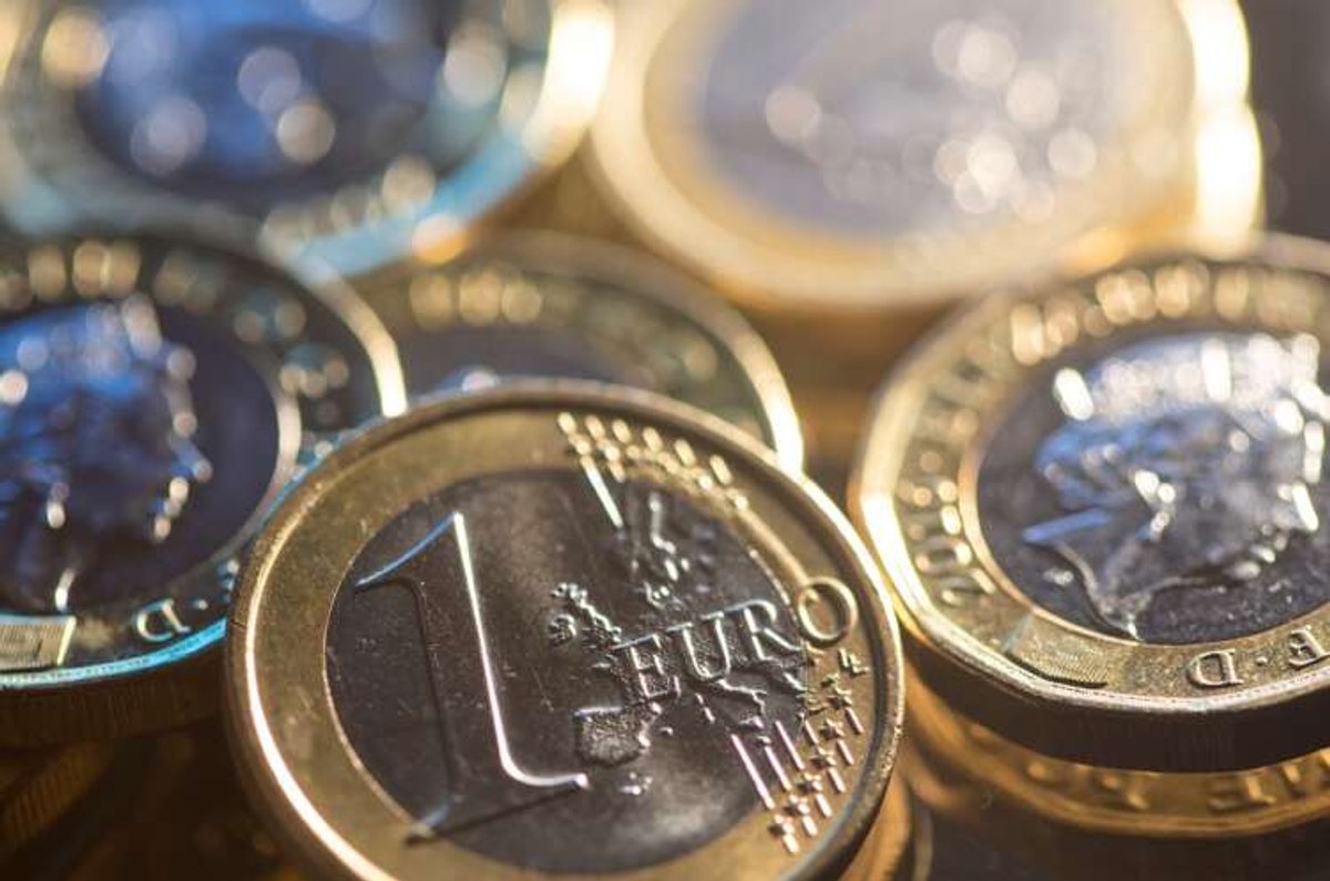 Illustration of Euro and British pound coins reflecting financial strategies - Global Banking & Finance Review
