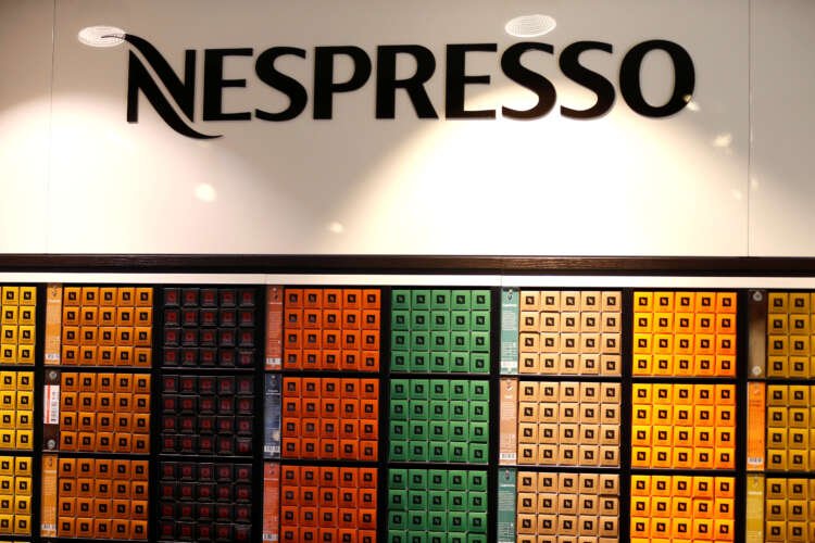 Nespresso coffee pods on display in Nestle's supermarket, highlighting recent sales performance - Global Banking & Finance Review