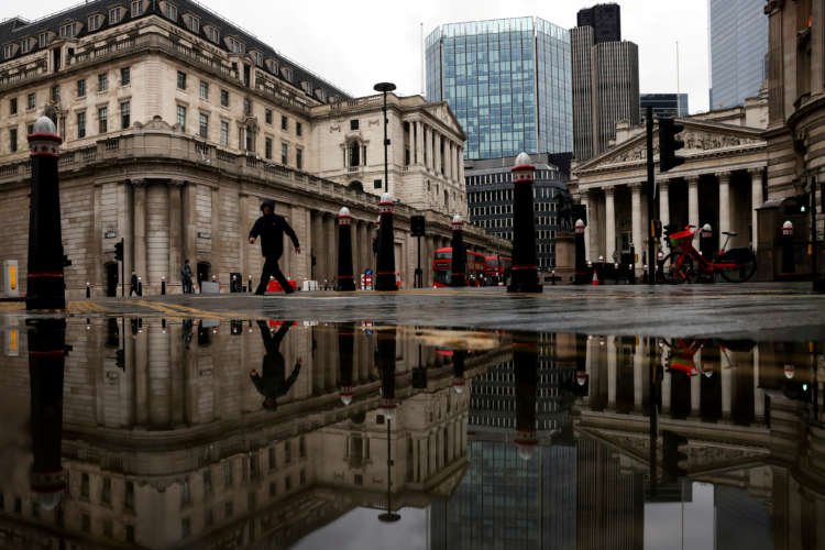 Reflection of the Bank of England and Royal Exchange in London puddle - UK loan scheme news - Global Banking & Finance Review