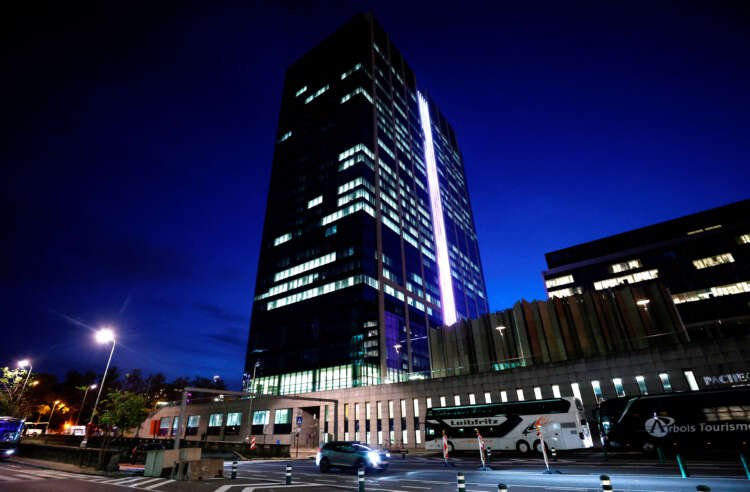Office building in Brussels illuminated at night, symbolizing Europe's commercial property market - Global Banking & Finance Review