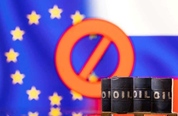 Models of oil barrels with EU and Russian flags, symbolizing sanctions on Russian oil - Global Banking & Finance Review