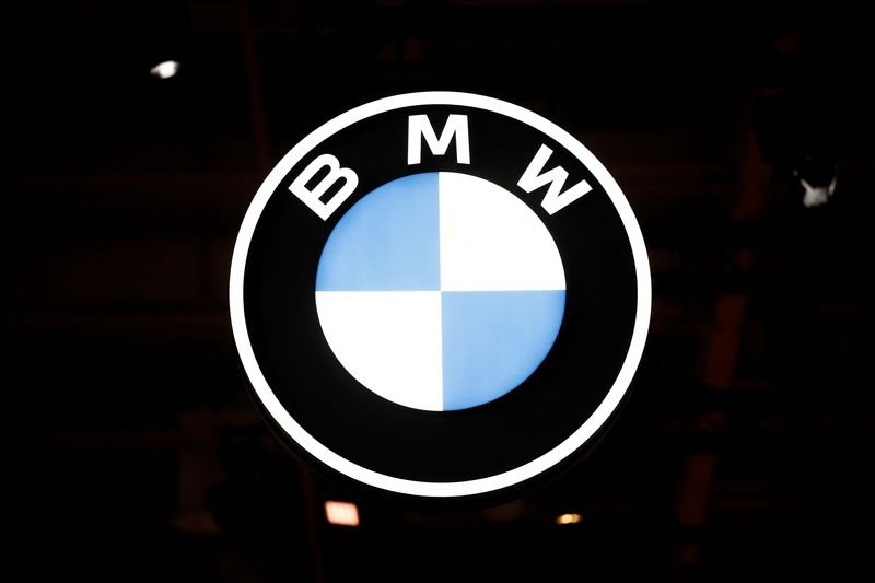 BMW logo and electric Mini car concept reflecting production review in UK - Global Banking & Finance Review