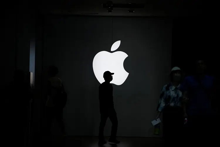 Apple logo representing job cuts in digital services amid AI focus - Global Banking & Finance Review