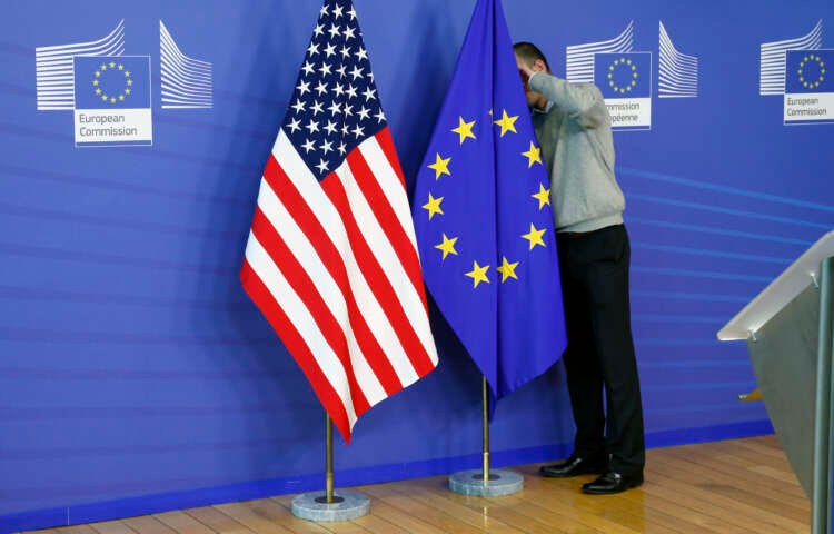 Image for EU, U.S. to end trade tariffs, call for new study into COVID-19 origins, summit draft says