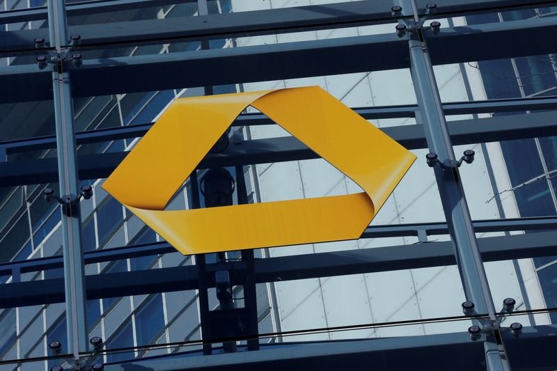 Commerzbank logo with a backdrop of financial charts symbolizing job cuts in Germany - Global Banking & Finance Review