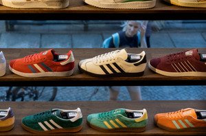 Adidas showcases its retro three-striped shoes, symbolizing strong Q4 sales performance - Global Banking & Finance Review