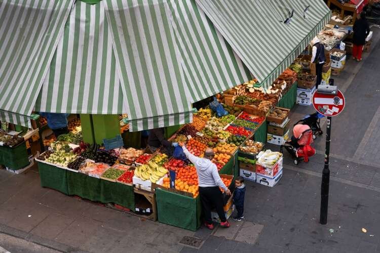 A man shops for fresh produce amidst rising UK food price inflation - Global Banking & Finance Review
