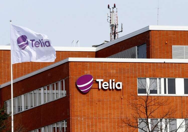 Flag at Telia offices in Helsinki, representing 5G demand and company earnings - Global Banking & Finance Review