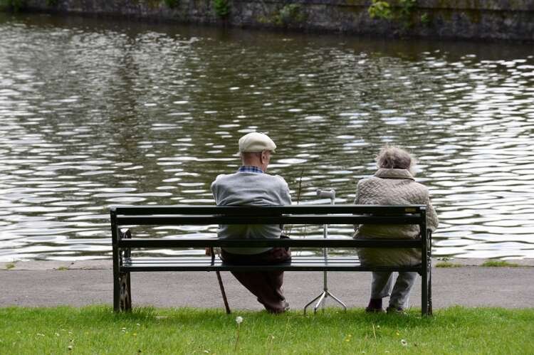 Pensioners enjoying a day in the park, highlighting UK pensions insurance market trends - Global Banking & Finance Review