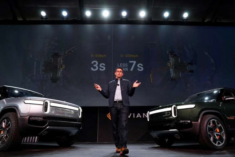 Rivian electric vehicles showcased at LA Auto Show, representing EV industry challenges - Global Banking & Finance Review