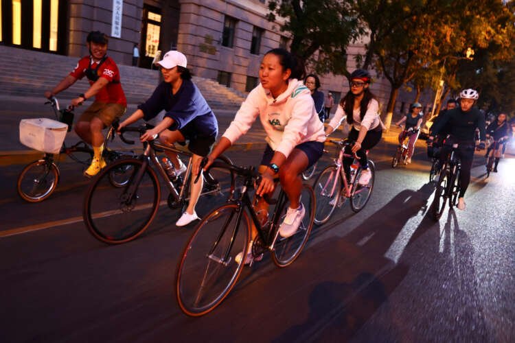 Cyclists riding premium bicycles in Beijing, showcasing urban cycling trend - Global Banking & Finance Review