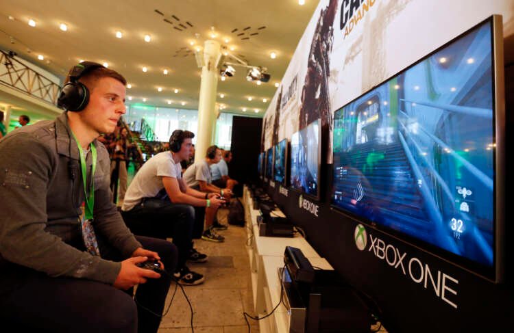 Gamer playing Call of Duty on Xbox, highlighting Microsoft and Nvidia's game deal - Global Banking & Finance Review