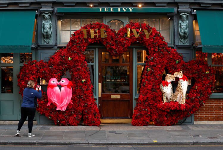 Valentine's Day floral display outside a London restaurant, highlighting seasonal retail trends - Global Banking & Finance Review
