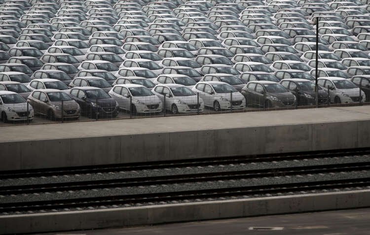 New cars parked at a cargo terminal, highlighting European car sales growth – Global Banking & Finance Review