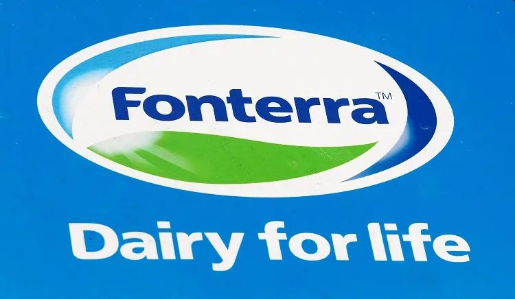 Fonterra logo with financial graphs illustrating profit decline and dividend announcement - Global Banking & Finance Review