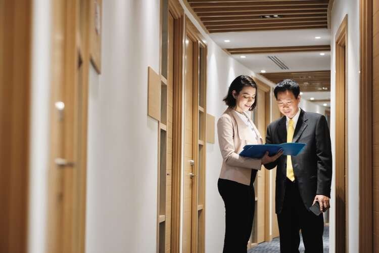 Business woman advising a client in financial services office - Global Banking & Finance Review