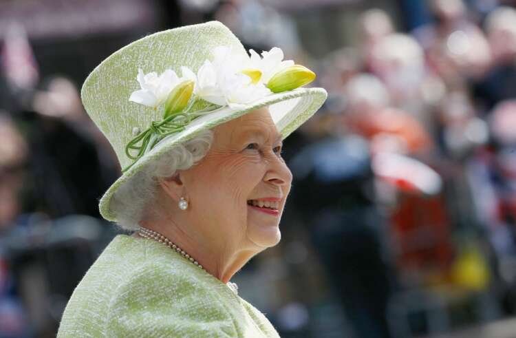 Queen Elizabeth II during her reign, symbolizing stability in a changing world - Global Banking & Finance Review