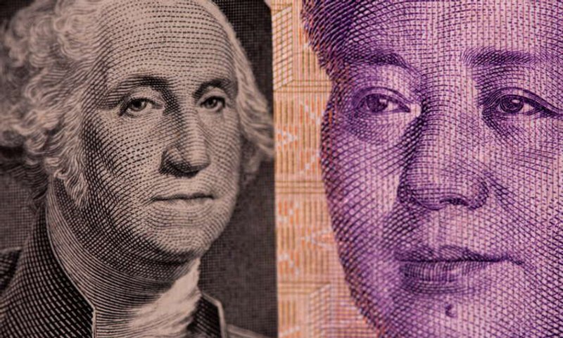 Image for Dollar rally pauses as Fed plays calm hand on inflation surprise