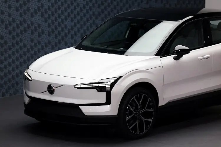 Volvo Cars logo with a backdrop of electric vehicles highlighting October sales growth - Global Banking & Finance Review