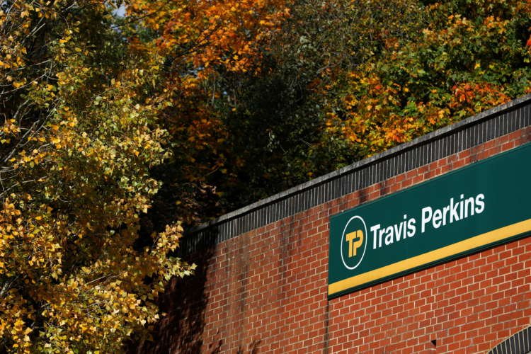 Travis Perkins signage at a building materials yard, relevant to Wickes demerger news - Global Banking & Finance Review