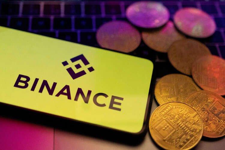 Smartphone displaying Binance logo, reflecting fintech challenges in European banking - Global Banking & Finance Review
