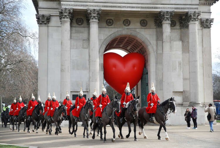 Members of the Household Cavalry near a large heart sculpture on Valentine's Day - Global Banking & Finance Review