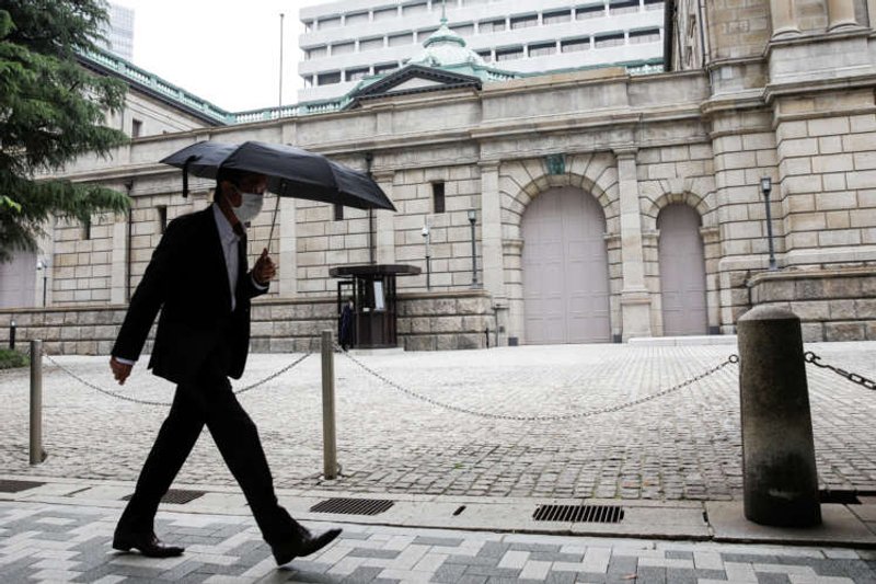Image for Bank of Japan lifts next year’s growth forecast, saves ammunition as virus risks linger