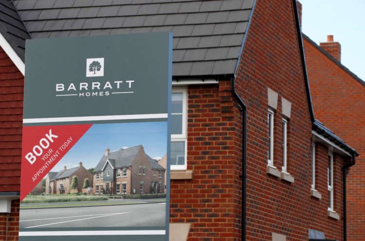 An advertising board of Britain’s largest homebuilder Barratt Developments is pictured in Aylesbury
