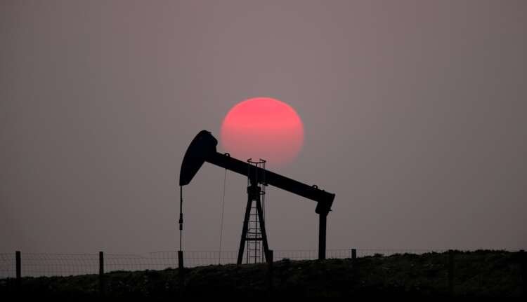Oil pump-jack at sunset highlighting increased oil demand amidst economic challenges - Global Banking & Finance Review