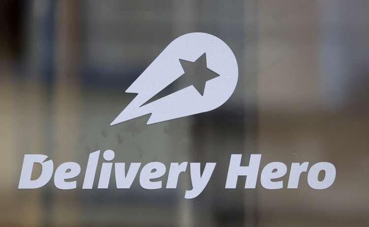 Delivery Hero logo displayed at headquarters in Berlin, symbolizing growth in GMV - Global Banking & Finance Review