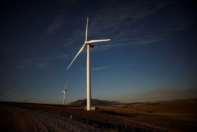 Wind turbines generating renewable energy, symbolizing the energy transition - Global Banking & Finance Review
