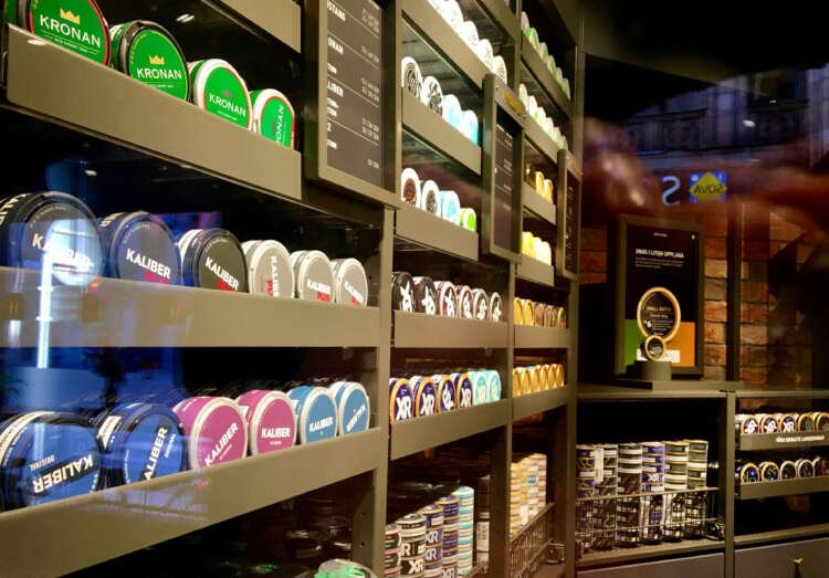 Moist powder tobacco snus cans on display at a Swedish Match store - Global Banking & Finance Review
