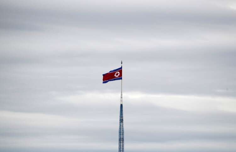 FILE PHOTO: A North Korean flag flutters on top of a 160-metre tower in North Korea’s propaganda village of Gijungdong, in this picture taken from the Tae Sung freedom village near the Military Demarcation Line (MDL), in Paju