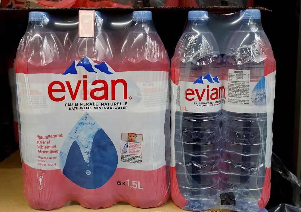 Image depicting Evian water bottles linked to Danone's carbon neutral lawsuit - Global Banking & Finance Review