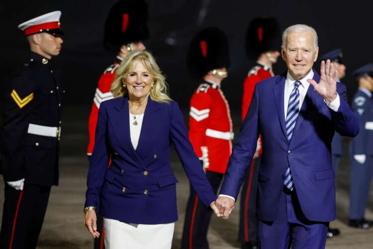 U.S. President Joe Biden and first lady Jill Biden react upon arrival at Cornwall Airport Newquay, near Newquay