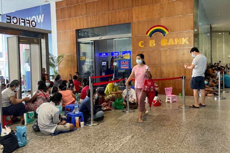 Image for Lines, tokens and money brokers: Myanmar’s crumbling economy runs low on cash