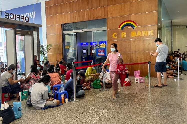 Image for Lines, tokens and money brokers: Myanmar’s crumbling economy runs low on cash