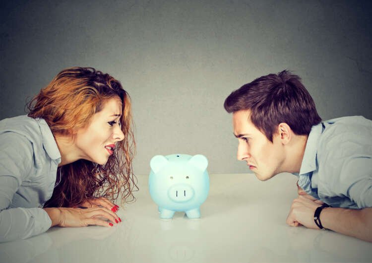 Couple discussing financial planning during divorce to protect assets - Global Banking & Finance Review