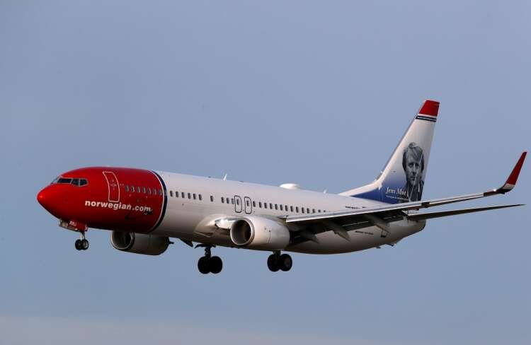 Norwegian Air Boeing 737 aircraft in flight, highlighting airline's Q1 financial challenges - Global Banking & Finance Review