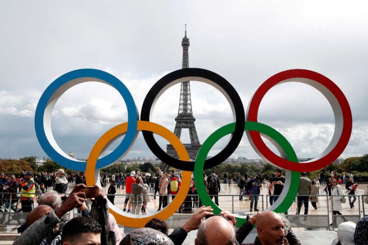 Olympic rings in front of the Eiffel Tower celebrating Paris 2024 Olympics - Global Banking & Finance Review