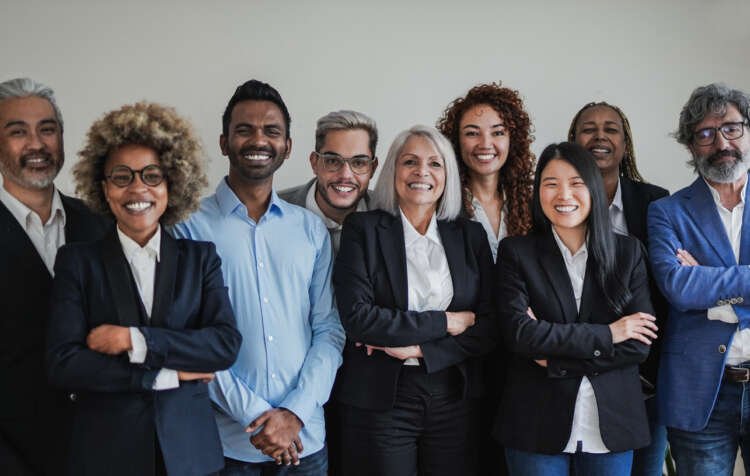 Happy multiethnic business people working together inside modern office