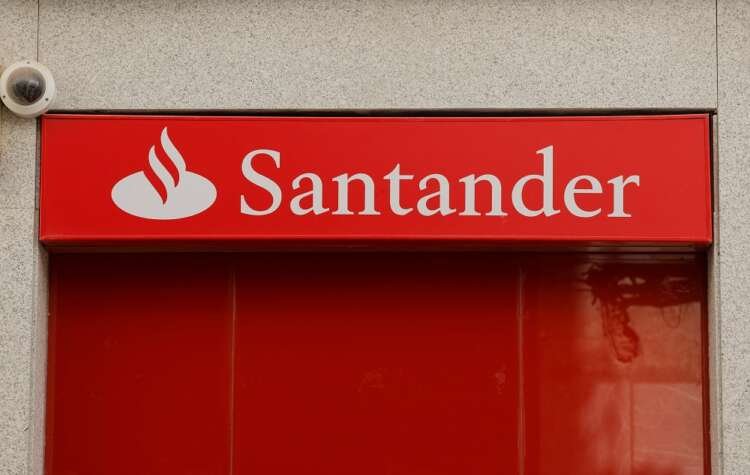Santander bank logo outside a branch, highlighting crypto transfer policies - Global Banking & Finance Review
