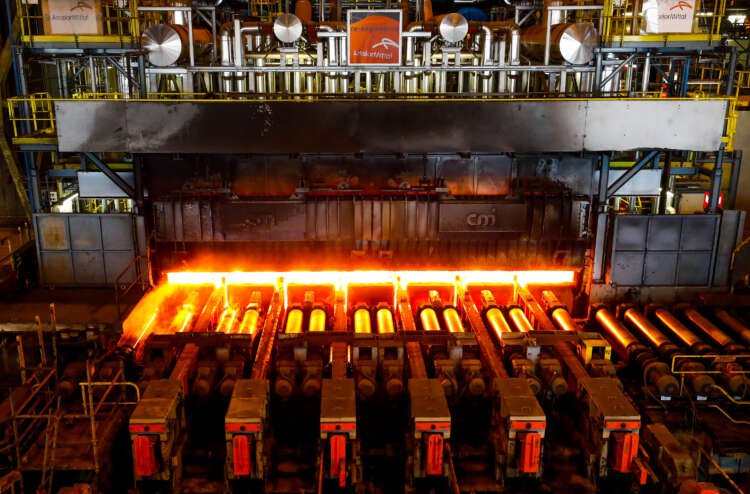 Red-hot steel plate being processed at ArcelorMittal plant, reflecting steel demand changes - Global Banking & Finance Review