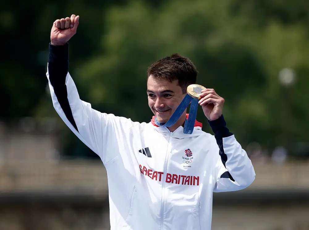 Triathletes competing in the Paris 2024 Olympics, showcasing France and Britain in victory - Global Banking & Finance Review