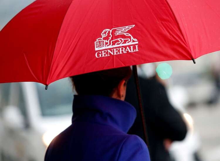 Woman with umbrella arriving at Generali shareholders meeting - Global Banking & Finance Review