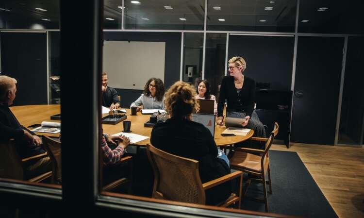 Boardroom meeting showcasing digital transformation for effective governance - Global Banking & Finance Review