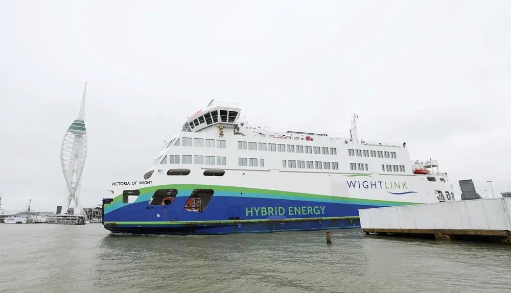 Electric ferry in port, highlighting Britain's green energy transition challenges - Global Banking & Finance Review